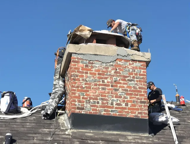 Wallingford Chimney Sweep installing a custom chimney crown in Wallingford, CT
