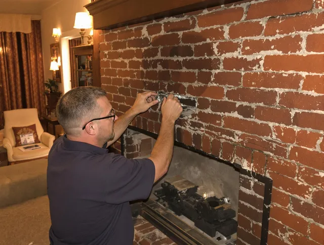 Wallingford Chimney Sweep expert fixing a fireplace in Wallingford, CT